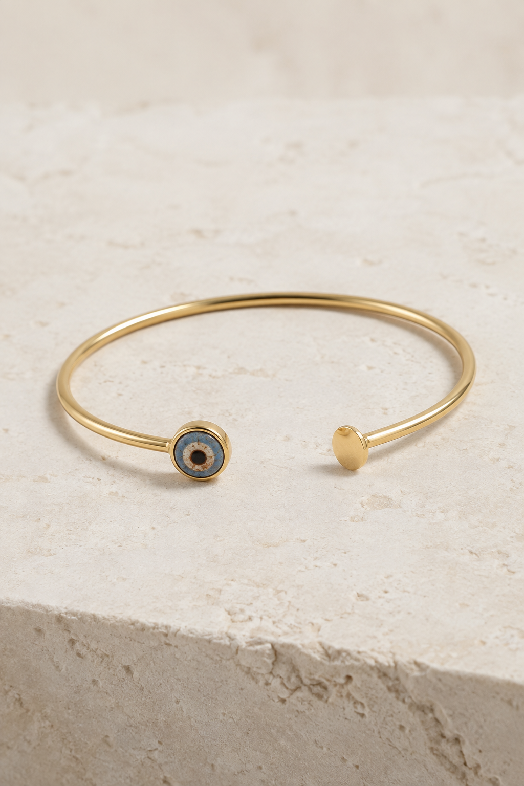 Phoenician eye bead set in a contemporary gold bracelet